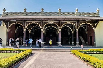 Visit Tipu Sultan's Summer Palace with taxi services to explore its historic wooden carvings.