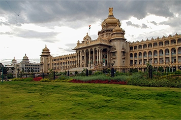 Book the best taxi services to visit Vidhana Soudha and admire its grand architecture.
